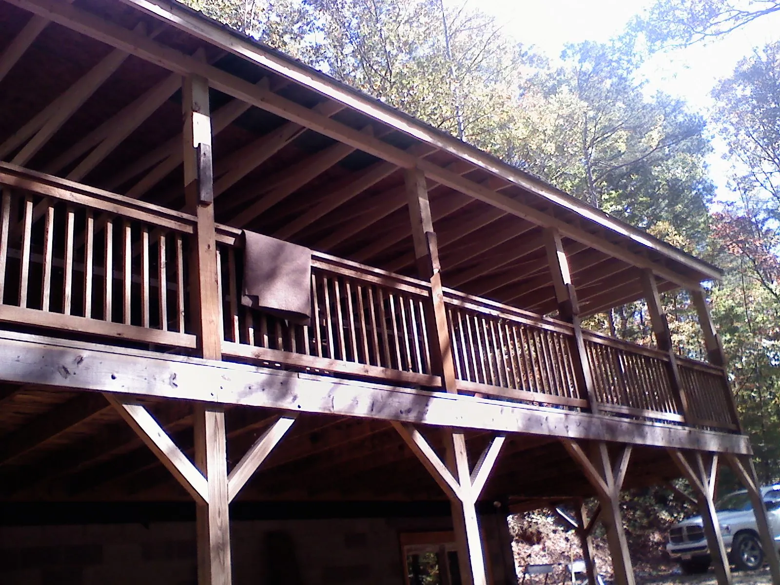Timber framing under a new elevated porch and deck — Roof Leak Repair in State College by Roofing Brothers